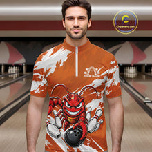 Load image into Gallery viewer, Front view of a male model in a bowling alley wearing an orange custom quarter zip bowling shirt with an aggressive crawfish bowling design and a distressed background.
