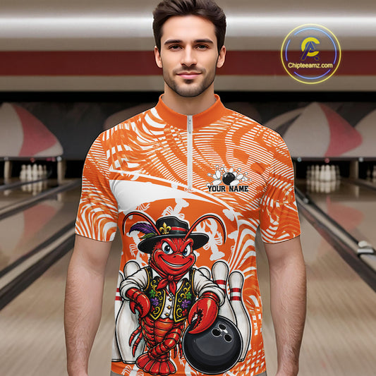 Front view of a male model in a bowling alley wearing an orange custom quarter-zip bowling shirt with a funny Cajun crawfish leaning on a bowling ball and a swamp-inspired texture background.
