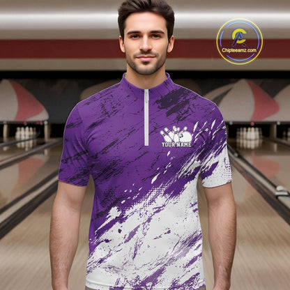 Man wearing a purple and white bowling shirt with a bowling alley in the background
