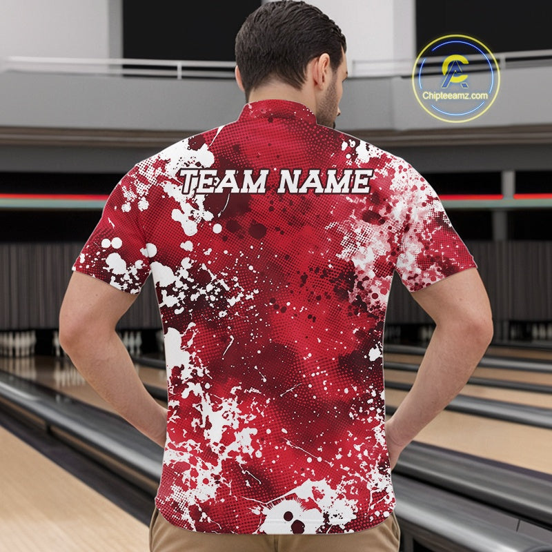 Man wearing a red and white patterned bowling shirt with 'TEAM NAME' on the back, standing in a bowling alley.