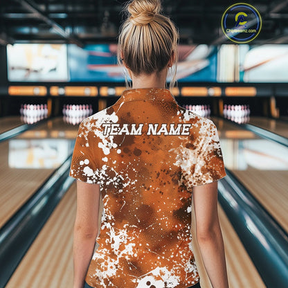 Person wearing a custom bowling shirt with 'TEAM NAME' printed on the back in a bowling alley.