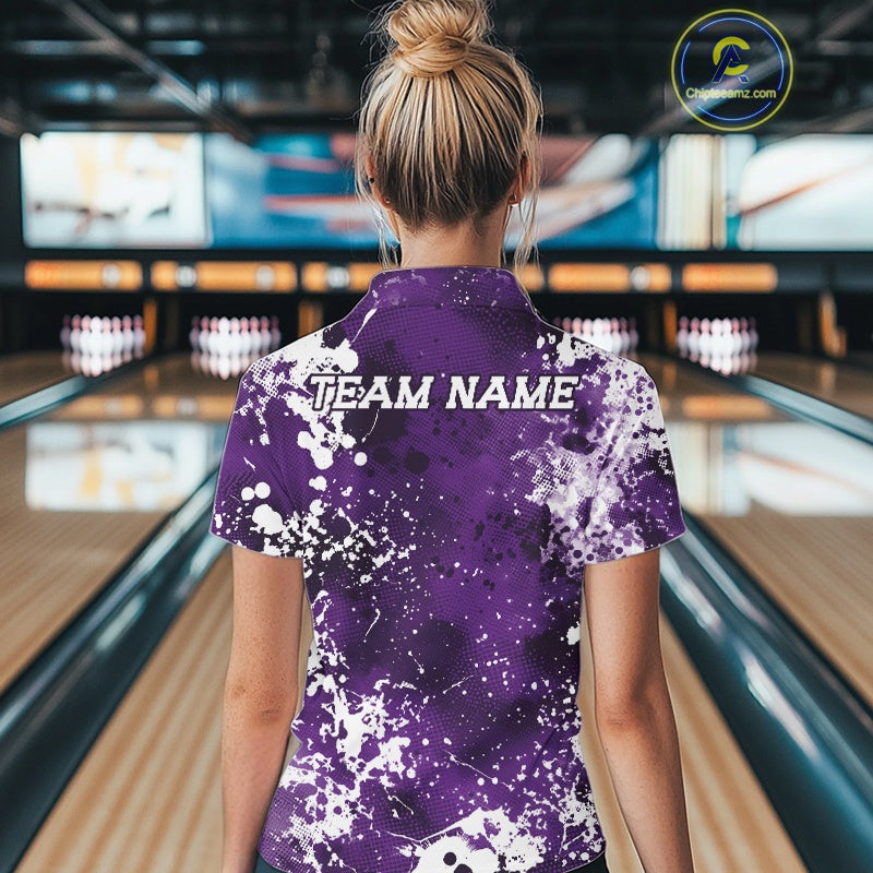 Person wearing a purple bowling shirt with 'TEAM NAME' text in a bowling alley.
