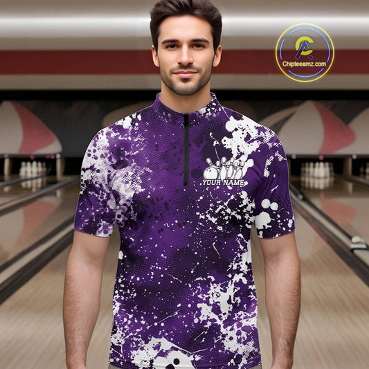 Man wearing a purple and white patterned shirt with 'Your Name' text in a bowling alley.
