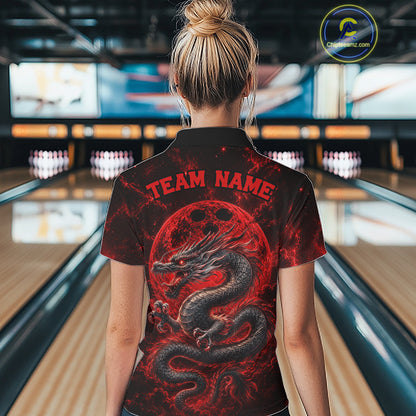 Back view of a female model in a bowling alley wearing a red custom bowling polo shirt featuring an ancient dragon, flames, and a moon-inspired bowling ball design.