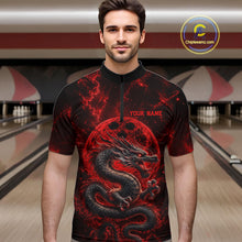 Load image into Gallery viewer, Front view of a male model in a bowling alley wearing a red custom quarter-zip bowling shirt featuring an ancient dragon, flames, and a moon-inspired bowling ball design.
