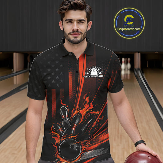 Male model at a bowling lane wearing a black and orange polo shirt with fiery bowling strike artwork and patriotic styling.