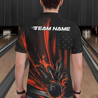 Back view of a male model in a bowling alley wearing a black and orange polo featuring a flaming bowling ball and pin impact design.