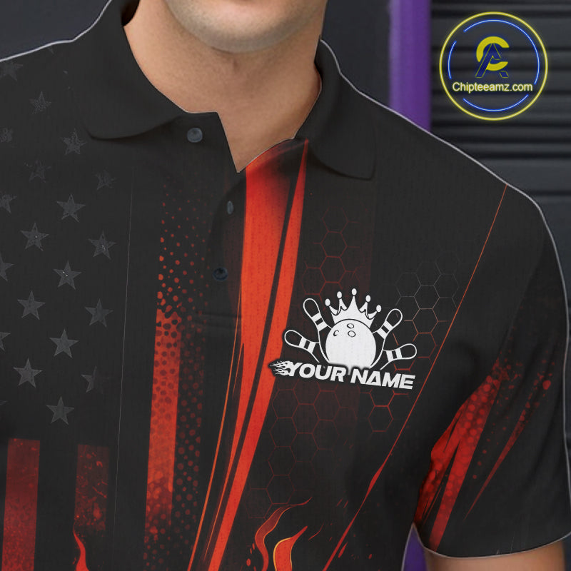Close-up of a black and orange bowling polo shirt left chest showing patriotic flames and bowling strike motif.