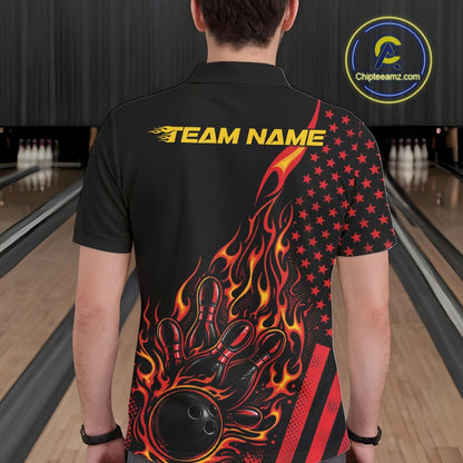 Back view of a male model in a bowling alley wearing a black polo shirt featuring a fiery bowling action scene with American flag accents.