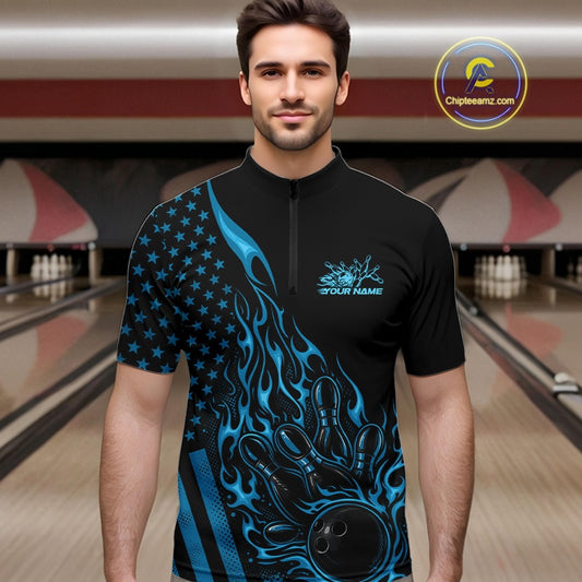 Male model wearing a black bowling quarter-zip shirt at a bowling lane with blue flame bowling strike artwork and patriotic graphics.