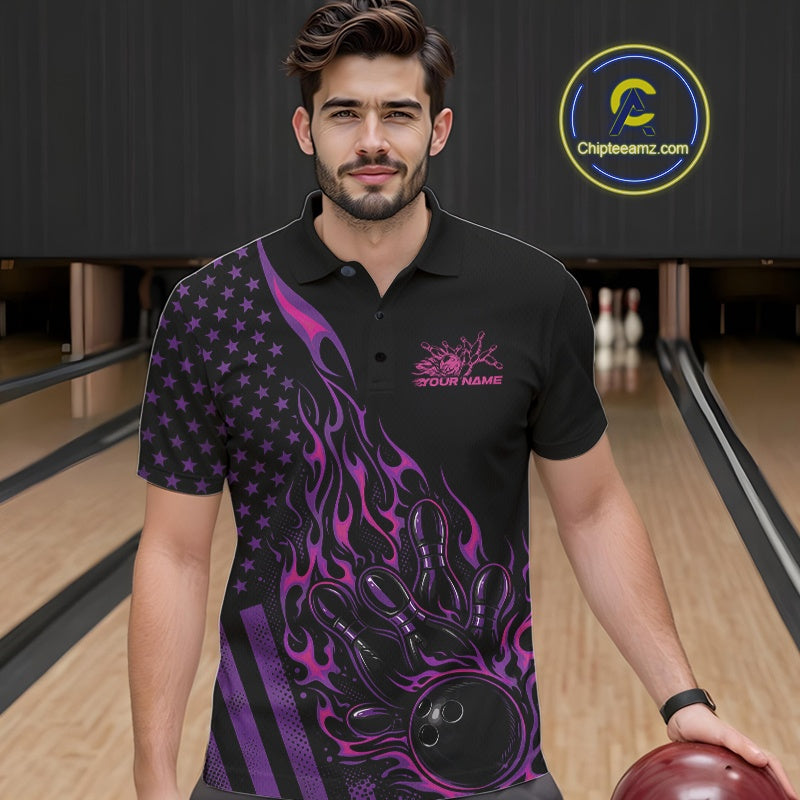 Male model at a bowling lane wearing a black bowling polo shirt with pink and purple flame bowling artwork and patriotic graphics.