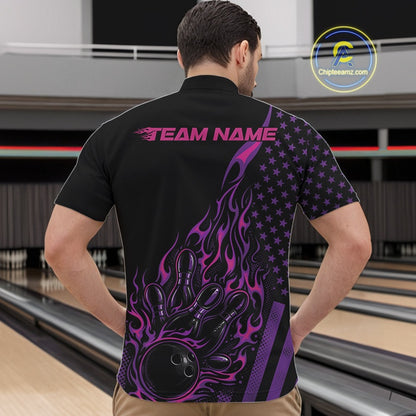 Front view of a male model in a bowling center wearing a black quarter-zip shirt featuring a colorful flaming bowling strike scene.