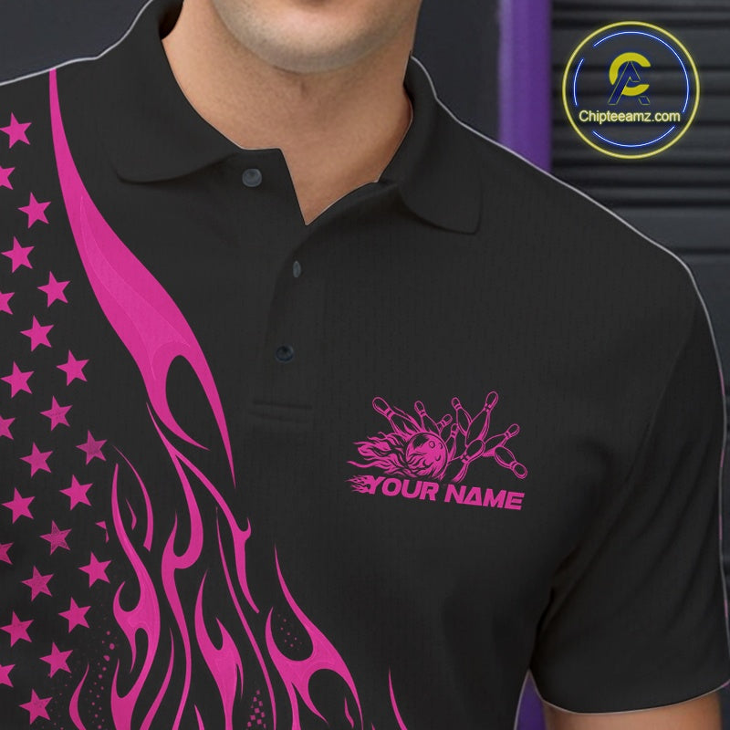 Close-up left chest detail of a black bowling polo shirt featuring a pink flaming bowling strike graphic with patriotic accents.