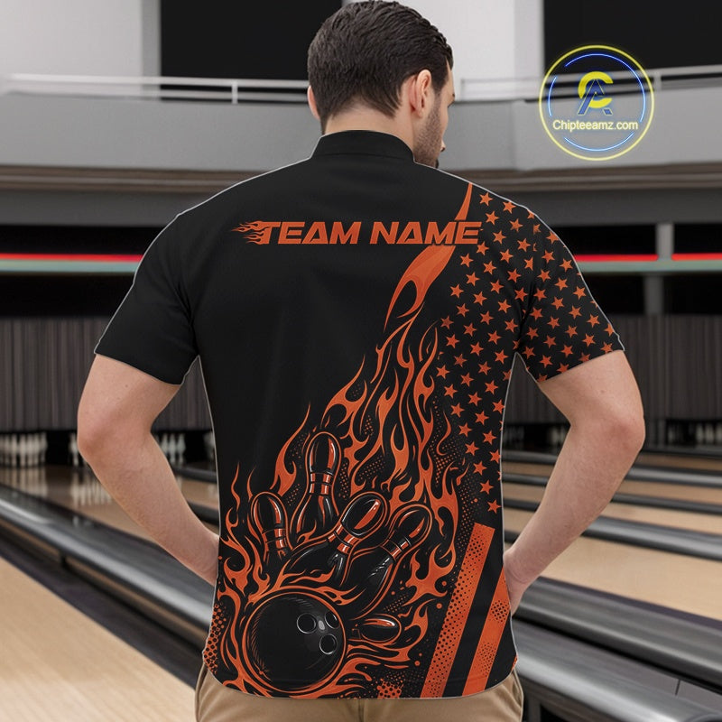 Front view of a male model in a bowling alley wearing a black quarter-zip shirt featuring an orange flaming bowling ball hitting the pins.