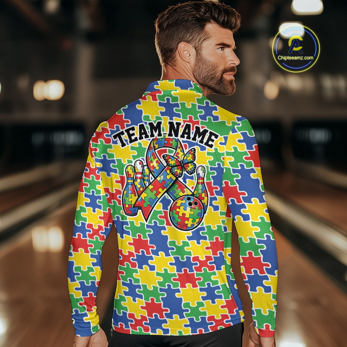 Seamless multicolor puzzle piece print displayed on white shirt with red, blue, green, and yellow tones in a continuous pattern