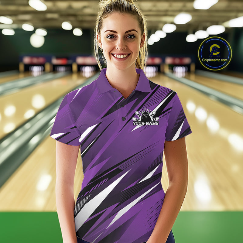 Woman wearing a purple bowling shirt with a logo and text on a bowling alley background