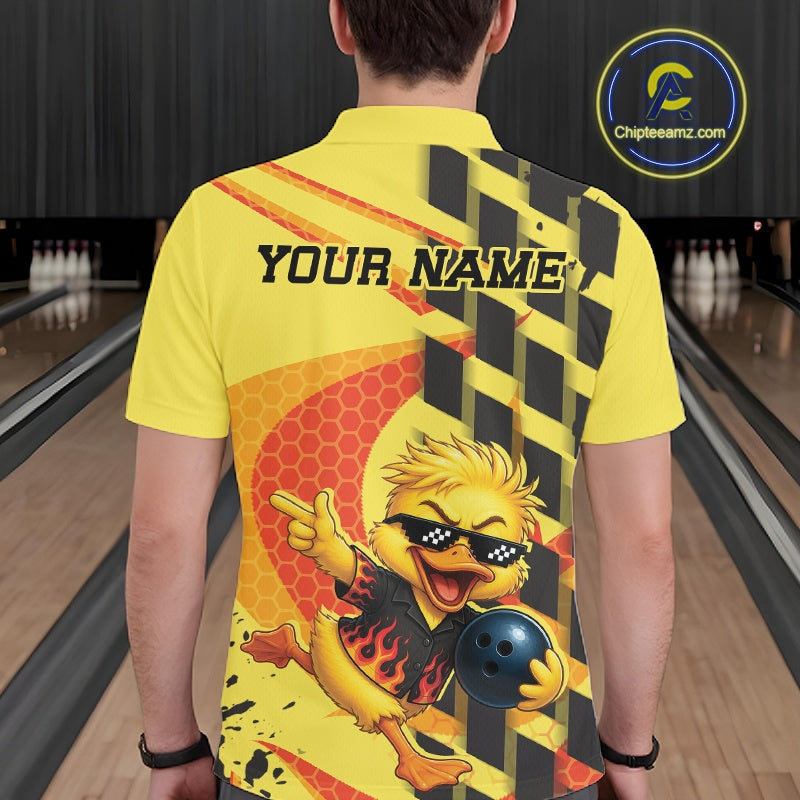 A man viewed from behind wearing a bright yellow short-sleeve bowling shirt with a cartoon flaming duck graphic, black text reading 'YOUR NAME', and a bowling alley background. A circular 'Chipteeamz.