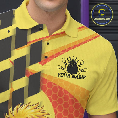 A close-up of a person wearing a bright yellow polo shirt with a bowling-themed graphic print. The shirt features a black crown bowling pin logo with the text 'YOUR NAME' on the chest, orange and red geometric patterns, and a black-and-yellow diagonal striped design on the left side.