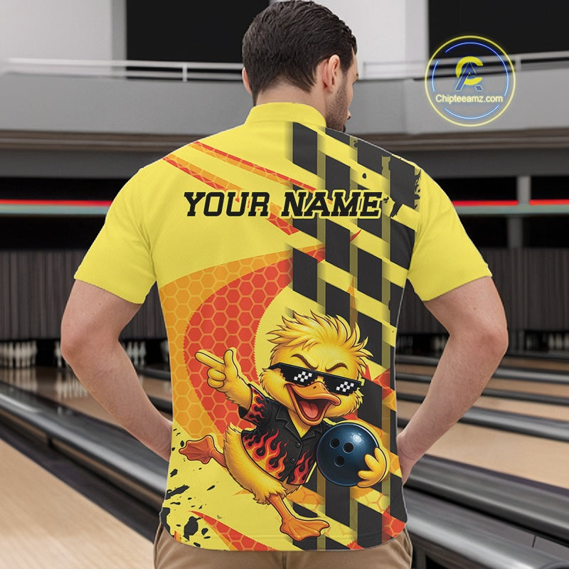 Back view of a male model wearing a yellow short-sleeve polo shirt with a cartoon bowling chick graphic, black and yellow hazard stripes,a orange honeycomb pattern