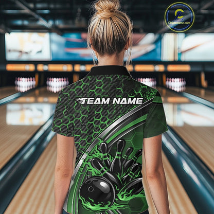 Female model from the back wearing a black and green bowling quarter zip with honeycomb accents and flame bowling action artwork in a bowling center.