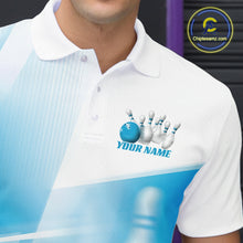 Load image into Gallery viewer, Close up left chest view of a white and blue bowling polo shirt with bowling ball and pins blended into a pink geometric pattern.
