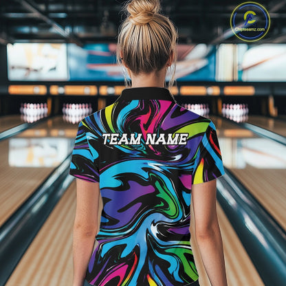 Person wearing a colorful bowling shirt with 'TEAM NAME' text in a bowling alley.