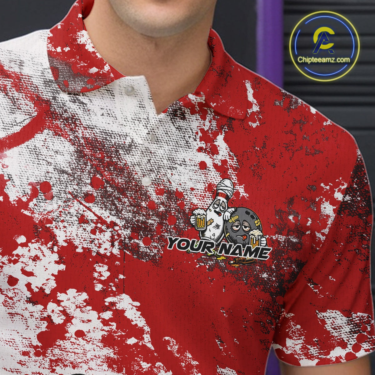 Close-up view of the left chest of a red and white grunge splatter polo shirt showing cartoon bowling pins and beer bottle illustration detail.