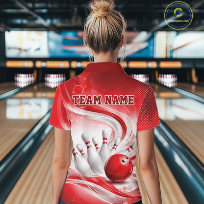 Female model standing in a bowling lane showing the back of a white and red bowling polo shirt with abstract wave lines and a glossy bowling ball striking pins graphic.
