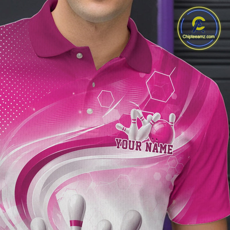 Close-up of the left chest on a white and pink bowling polo shirt showing abstract wave lines with a glossy bowling ball striking pins.