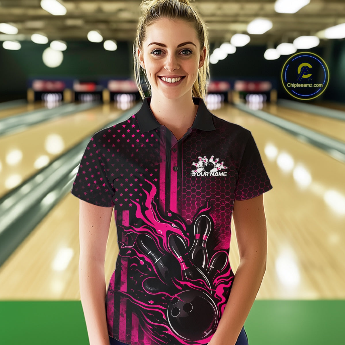 Female model wearing a black and pink bowling polo shirt at a bowling lane with fiery bowling strike artwork and patriotic accents.