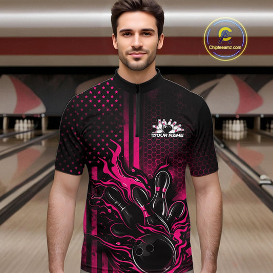 Male model wearing a black and pink bowling quarter-zip shirt at a bowling lane with fiery bowling strike graphics and patriotic flag-inspired accents.