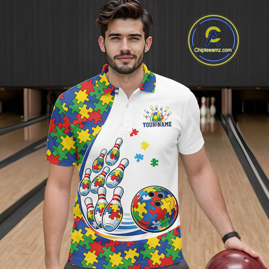Male model in a bowling lane wearing a white polo shirt, front view showcasing colorful autism-themed bowling strike design with puzzle accents
