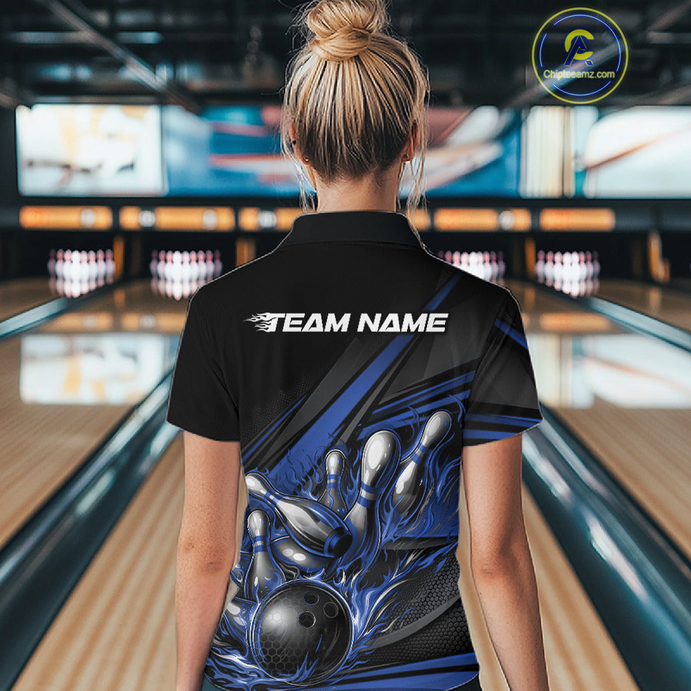 Female model in a bowling alley, back view of black polo shirt featuring blue flame bowling ball and geometric stripe pattern design