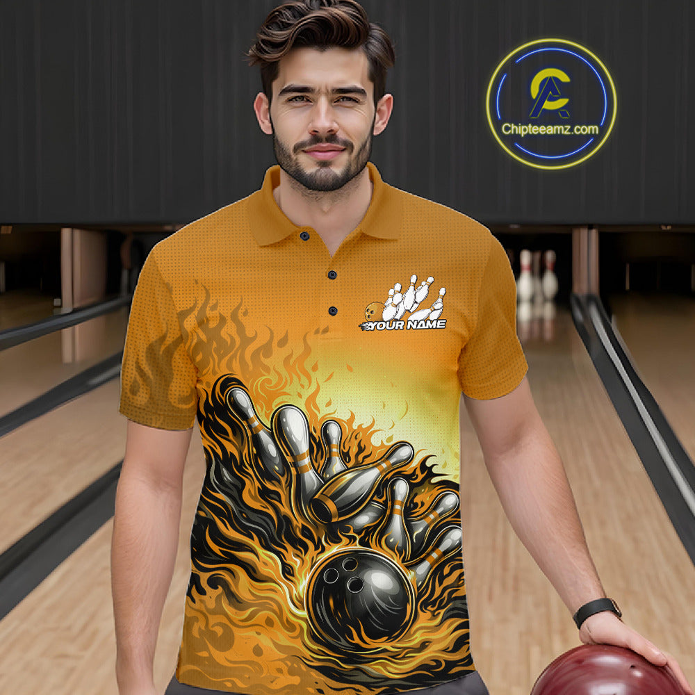 Male model in a bowling lane wearing a yellow polo shirt, front view featuring flame bowling ball knocking down pins artwork