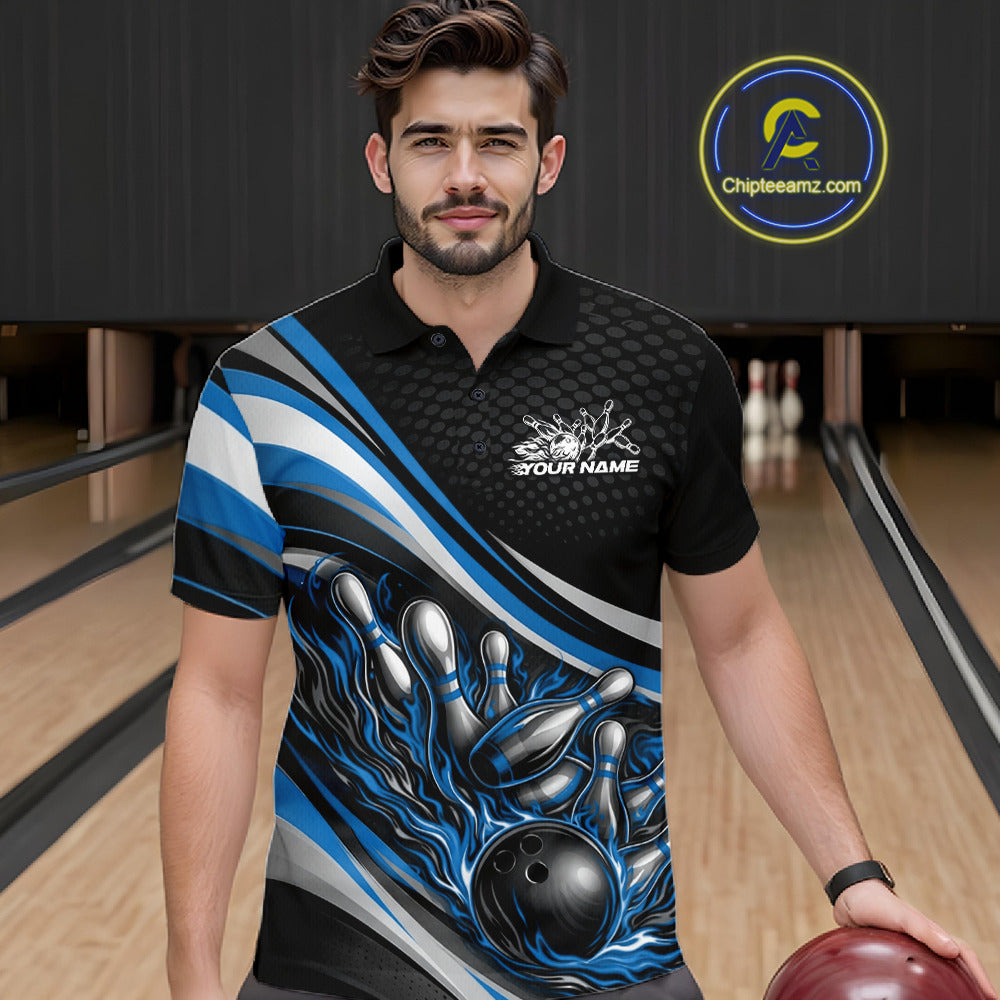 In a bowling lane, male model wearing a black and blue polo shirt, flame bowling ball striking pins with glowing fire-inspired sports graphics.