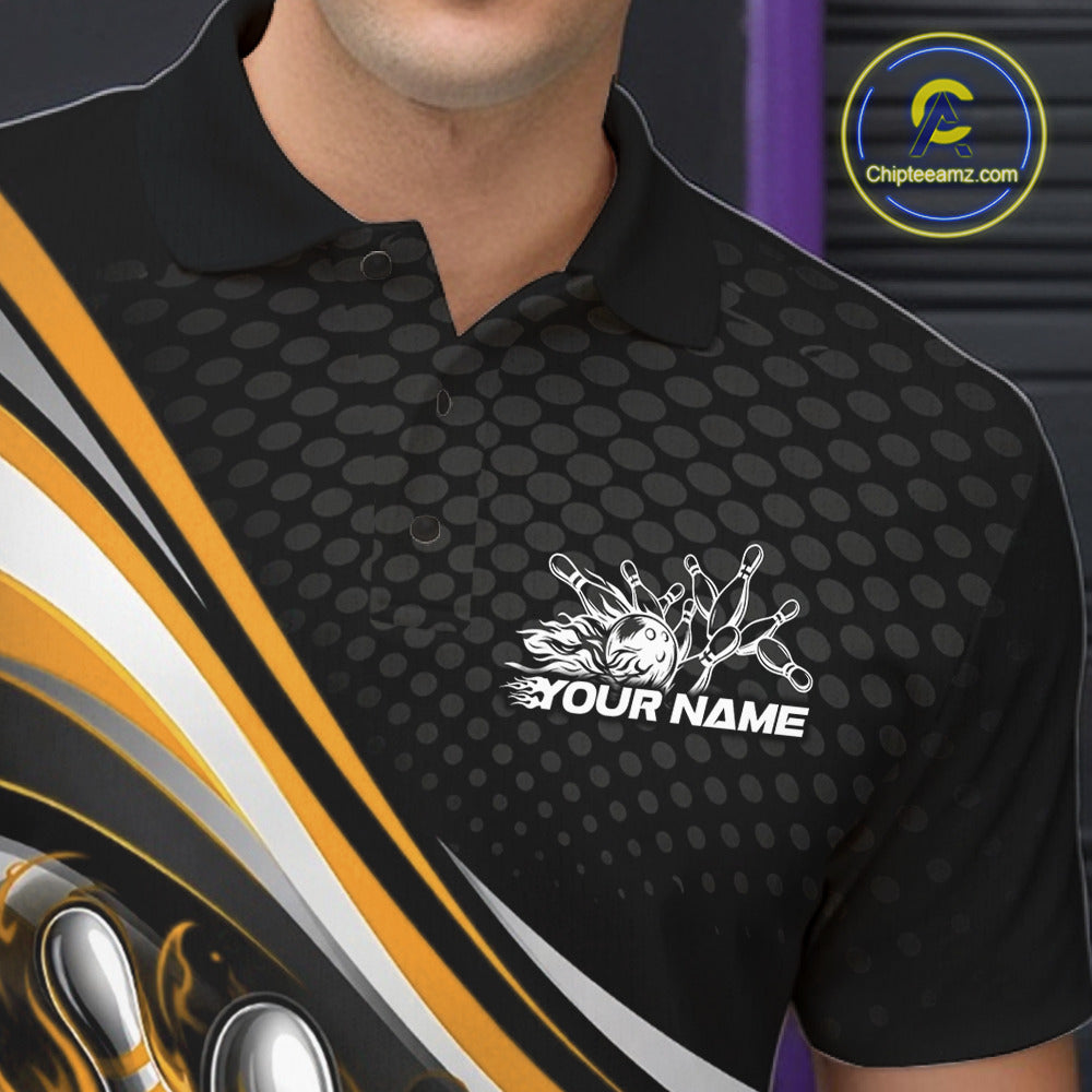 Close-up view of left chest area of a black and yellow polo shirt, showing small flame bowling ball and pins graphic detail.