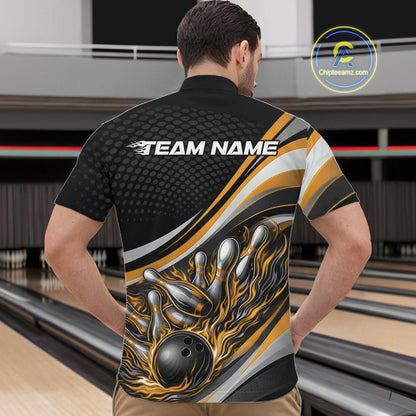 Male model in a bowling lane wearing a black and yellow quarter-zip shirt, fiery bowling ball hitting pins with dynamic sports-inspired artwork.