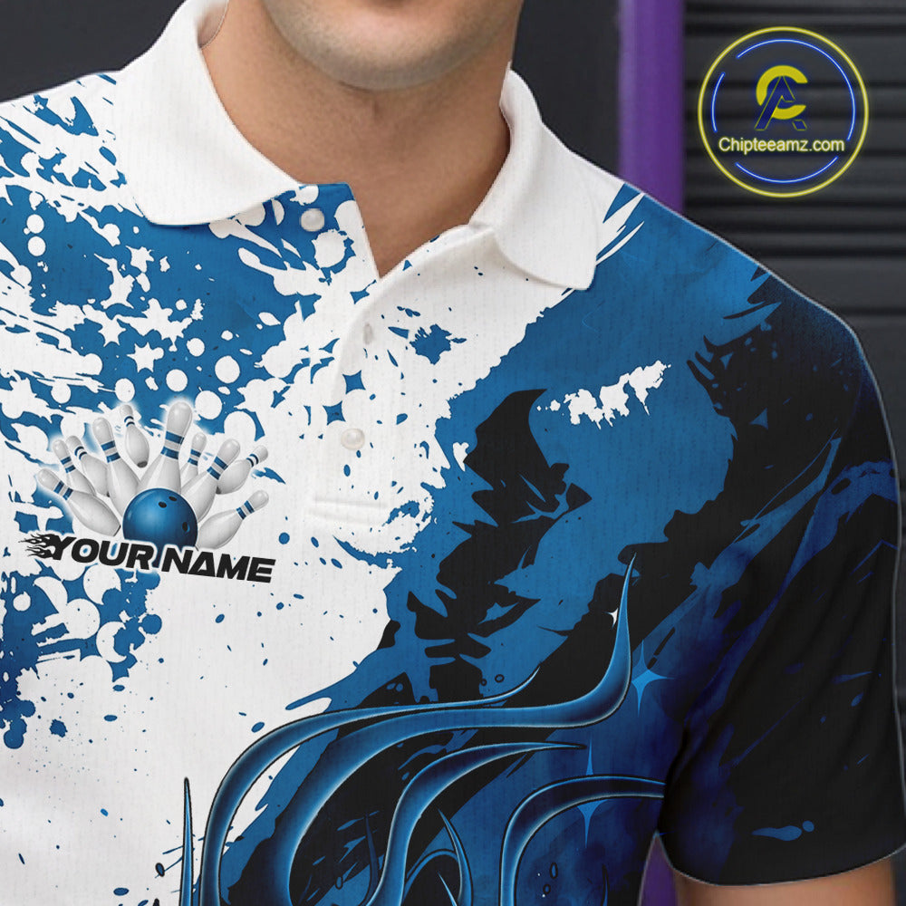 Close up left chest of bowling polo shirt, black fabric with blue and white flame bowling ball and pins emblem, detailed apparel branding perspective