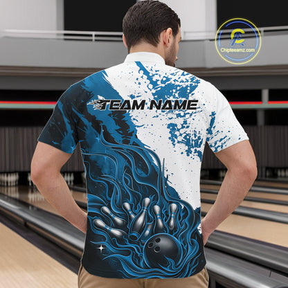 Front view of a male model in a bowling lane wearing a black quarter-zip shirt featuring blue and white flame bowling ball and pins artwork with dynamic sports design.