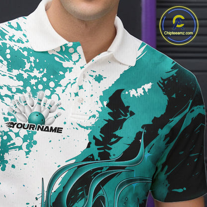 Close up left chest of bowling polo shirt, black fabric with turquoise blue and white flame bowling ball and pins emblem, detailed apparel branding view