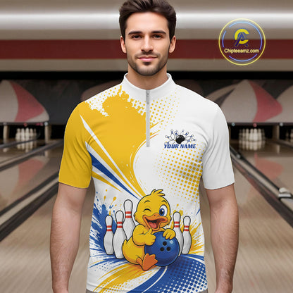 A man wearing a custom bowling-themed short-sleeve quarter-zip shirt with a yellow duck graphic, set against a blurred bowling alley background. 