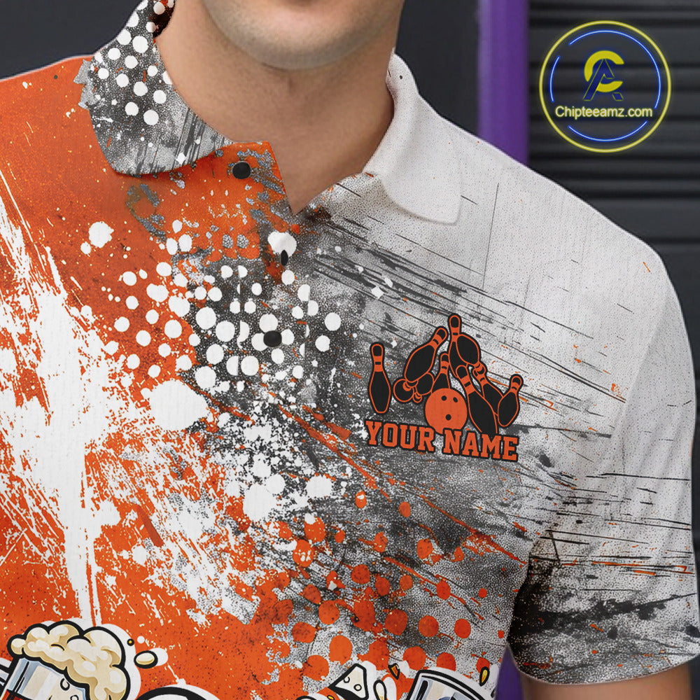 Close-up view of the left chest of an orange and white grunge splatter polo shirt showing humorous bowling ball and pin fighting illustration detail.