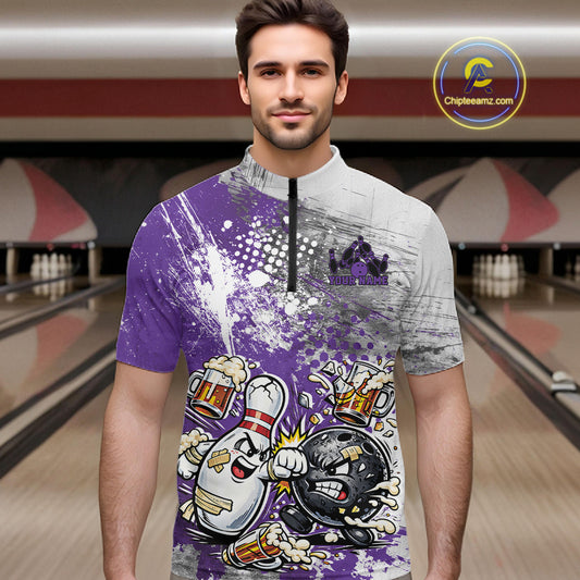 Front view of a male model in a bowling lane wearing a purple and white grunge splatter bowling quarter-zip shirt with funny cartoon bowling ball and pin fist-fighting artwork.
