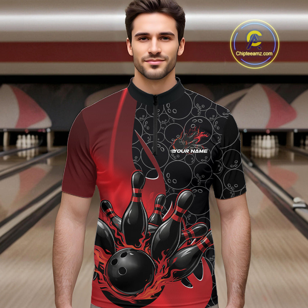Male model in a bowling lane wearing black and red quarter zip shirt, front view featuring flaming black bowling ball striking pins dynamic sports artwork
