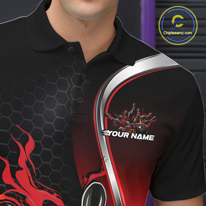 Close-up view of the left chest area of a black and red bowling polo shirt showing a flame bowling ball and pins design detail.