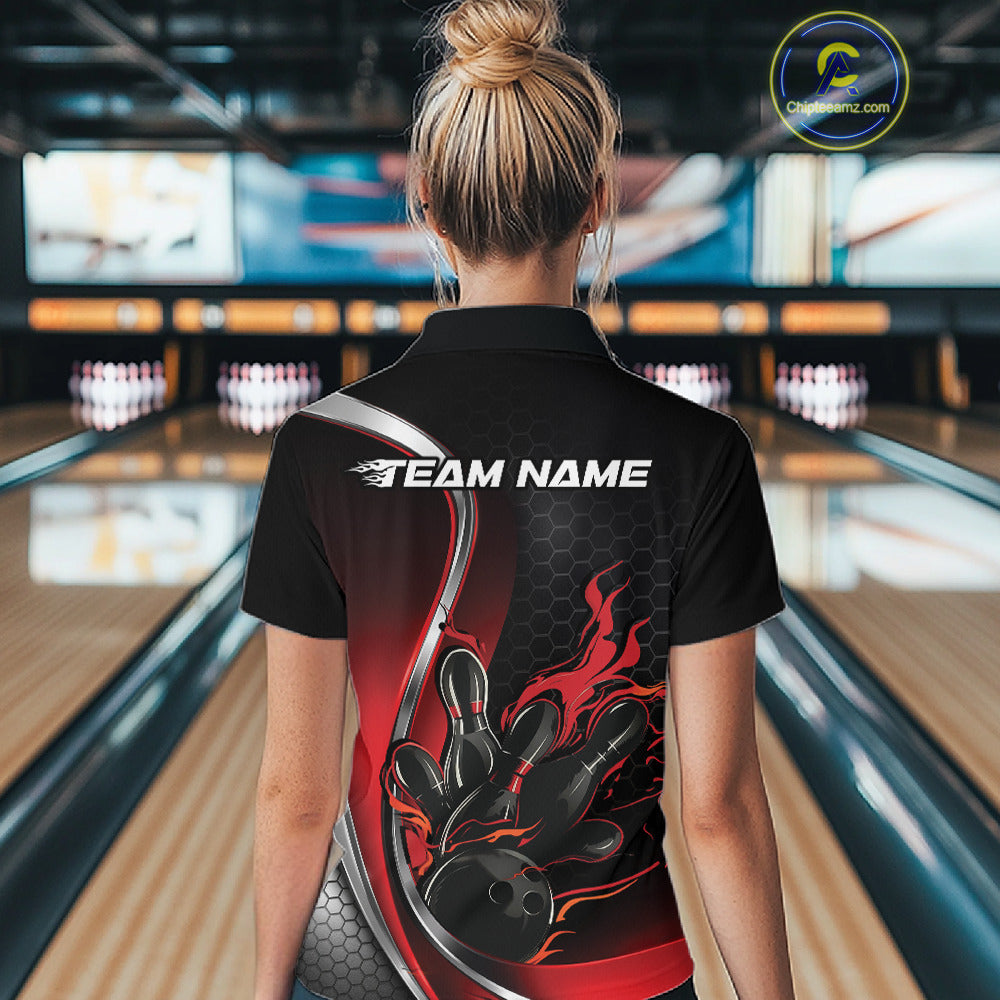 Female model back view in bowling center wearing black and red polo shirt showcasing flame bowling ball striking pins in bold dynamic artwork.