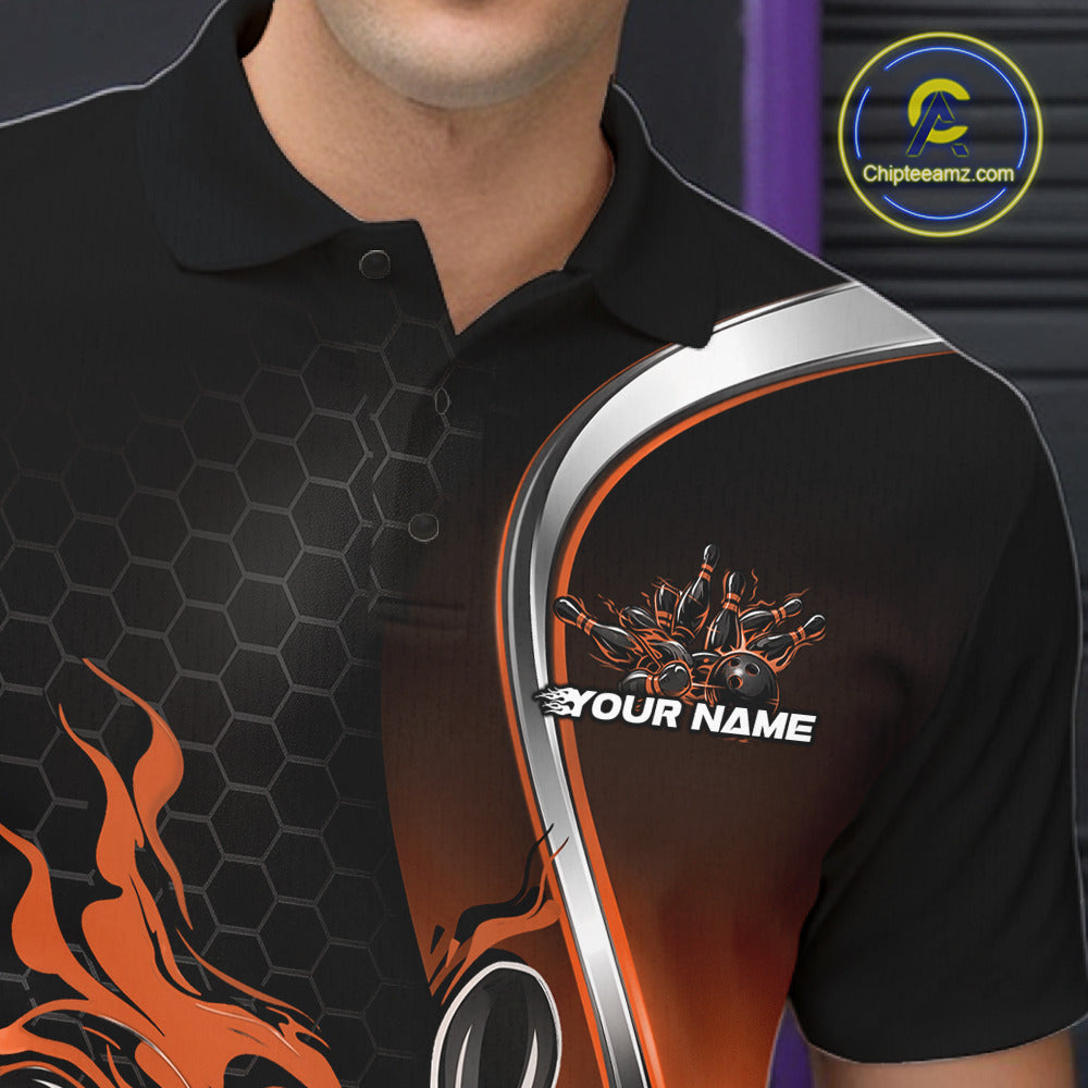 Close-up view of the left chest area of a black and orange bowling polo shirt showing a flame bowling ball and pins design detail.