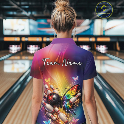 Back view of a female model in a bowling center wearing a bowling quarter-zip shirt showcasing a rainbow butterfly and bowling pin graphics.