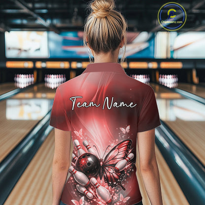 Back view of a female model in a bowling venue wearing a red quarter-zip bowling shirt featuring a butterfly and bowling-themed graphics.