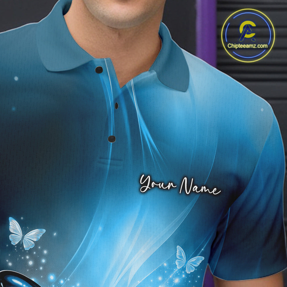Close-up left chest detail of a blue bowling polo shirt with a butterfly beside a bowling ball and scattered pin artwork.